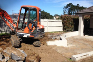 Pulling up rock for a landscaping project