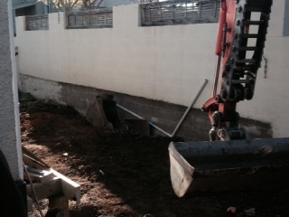 Photo of earthmoving equipement working in a backyard in Auckland